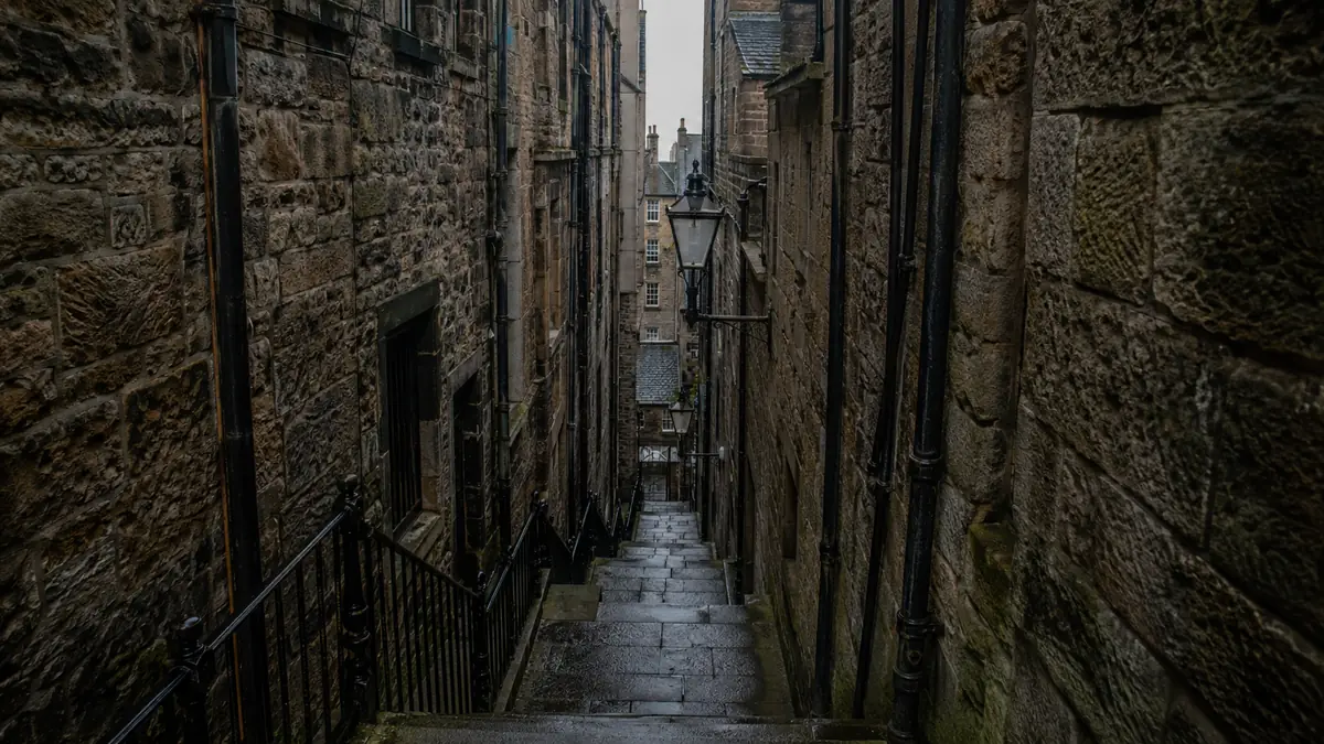 Edinburgh's Old Town: the closes, the wynds and the volcanic rock the whole series is built on. Rankin's city is a character, not a backdrop.