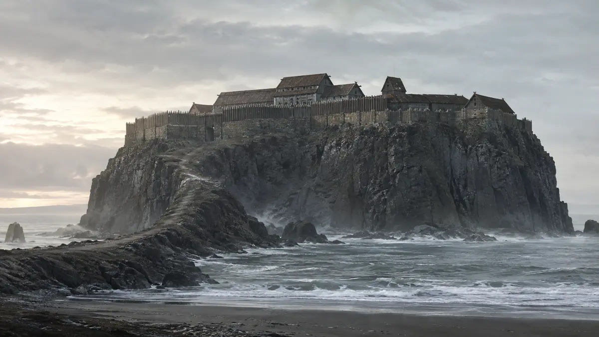 A clifftop fortress above the sea, reachable only by a single narrow neck of rock